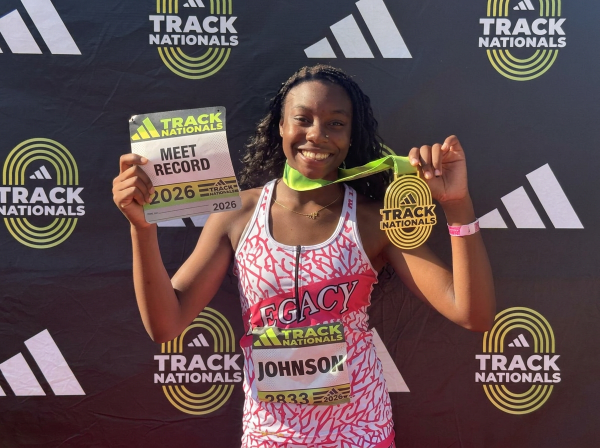 Zoei Johnson holding her Track Nationals meet record card and gold medal